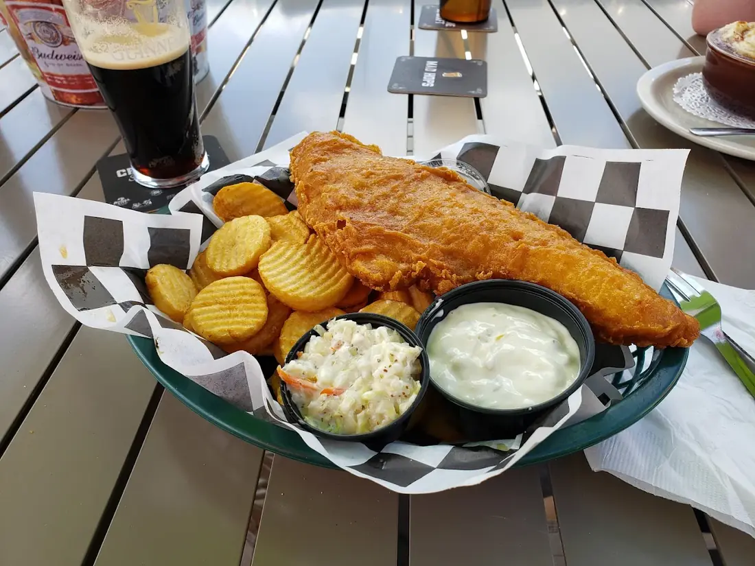 Beer-battered Icelandic haddock fish and chips with house tartar and coleslaw
