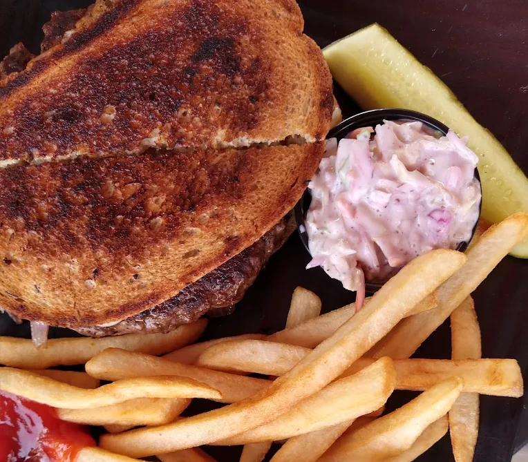 Fitzgerald's patty melt with caramelized onions and Swiss on grilled marbled rye